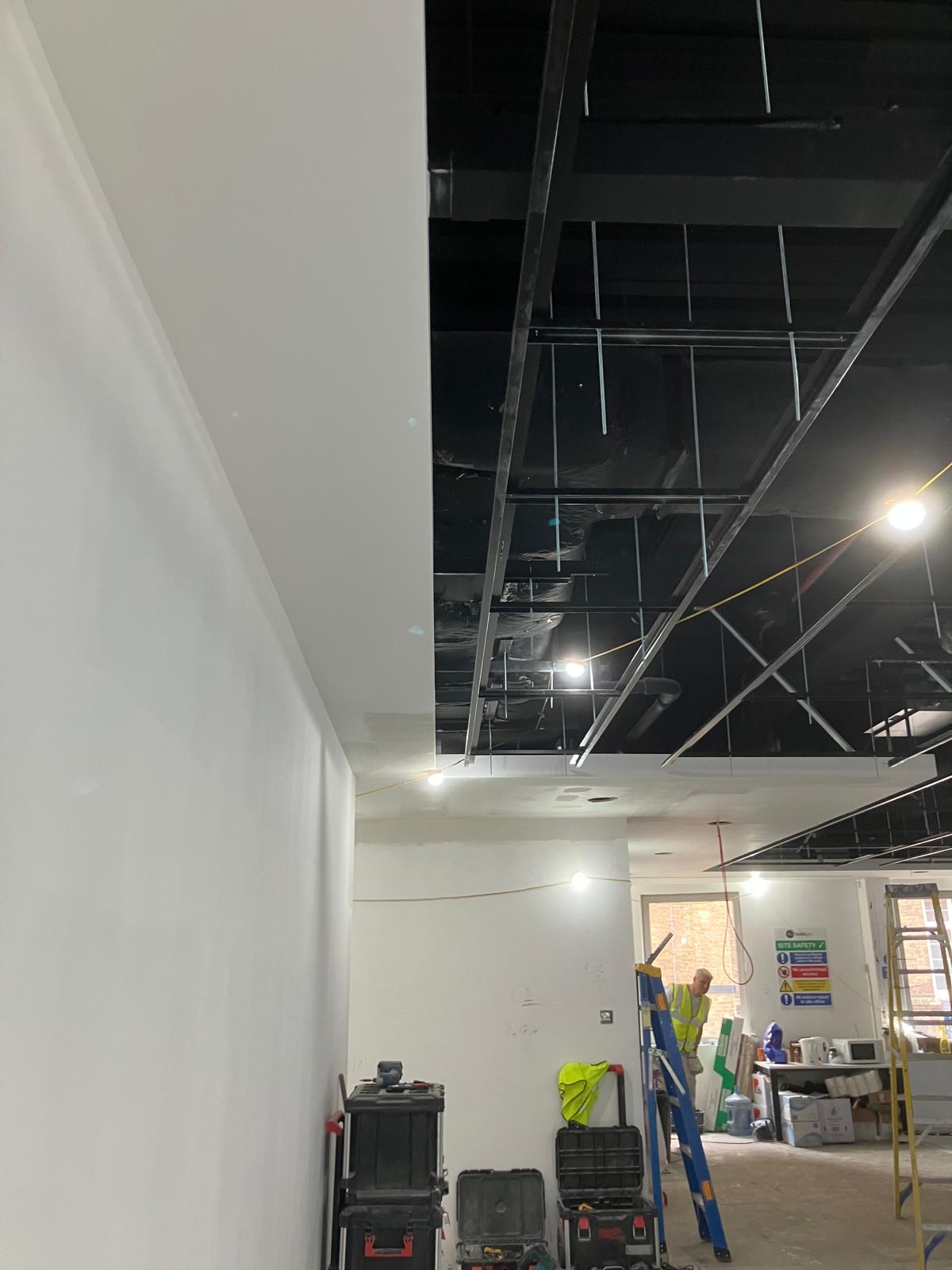 Ceiling grid installation in progress